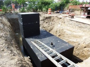 4' x 4' precast concrete riser with hatch casted in the top.